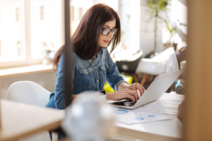 woman working on laptop computer at desk